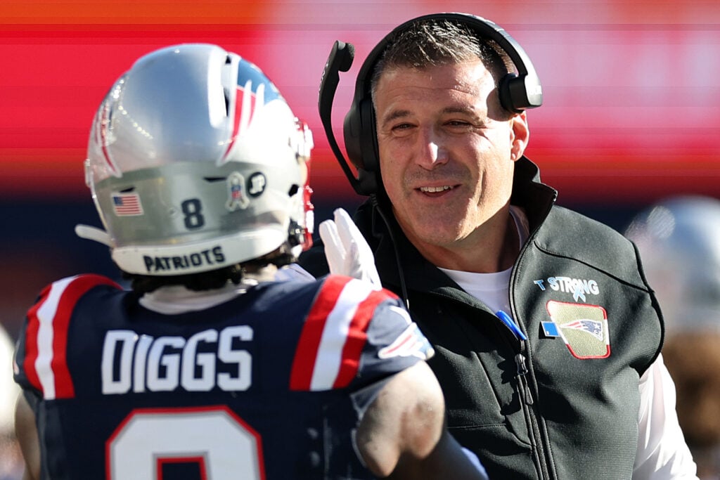 New England Patriots head coach Mike Vrabel celebrates with Stefon Diggs #8 after he scored a touchdown during the NFL 2025 game between Atlanta Falcons and New England Patriots at Gillette Stadium.