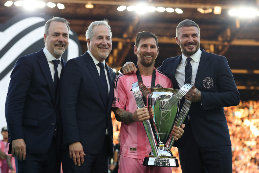 José Mas, Jorge Mas and Sir David Beckham, co-owners of Inter Miami CF pose with the Champion's trophy next to Lionel Messi #10 after winning the Audi 2025 MLS Cup Final match between Inter Miami CF and Vancouver Whitecaps FC at Chase Stadium.