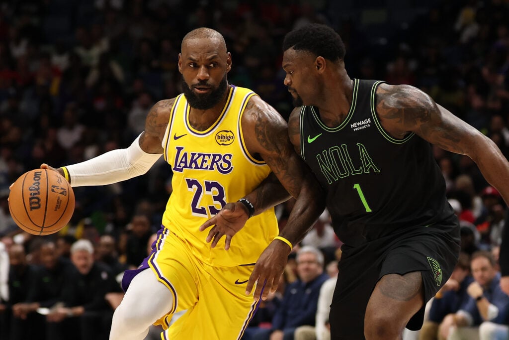 LeBron James #23 of the Los Angeles Lakers drives the ball around Zion Williamson #1 of the New Orleans Pelicans at Smoothie King Center on January 06, 2026 in New Orleans, Louisiana.