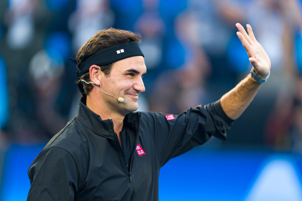Roger Federer of Switzerland acknowledges the audience as he enters the arena during the Opening Ceremony ahead of the 2026 Australian Open at Melbourne Park.