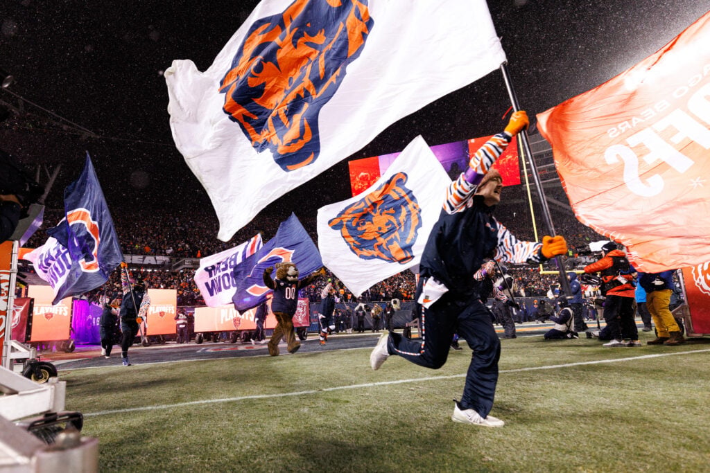 Chicago Bears flags are ran out onto the field during team introductions prior to an NFL divisional playoff game against the Los Angeles Rams at Soldier Field on January 18, 2026 in Chicago, Illinois.