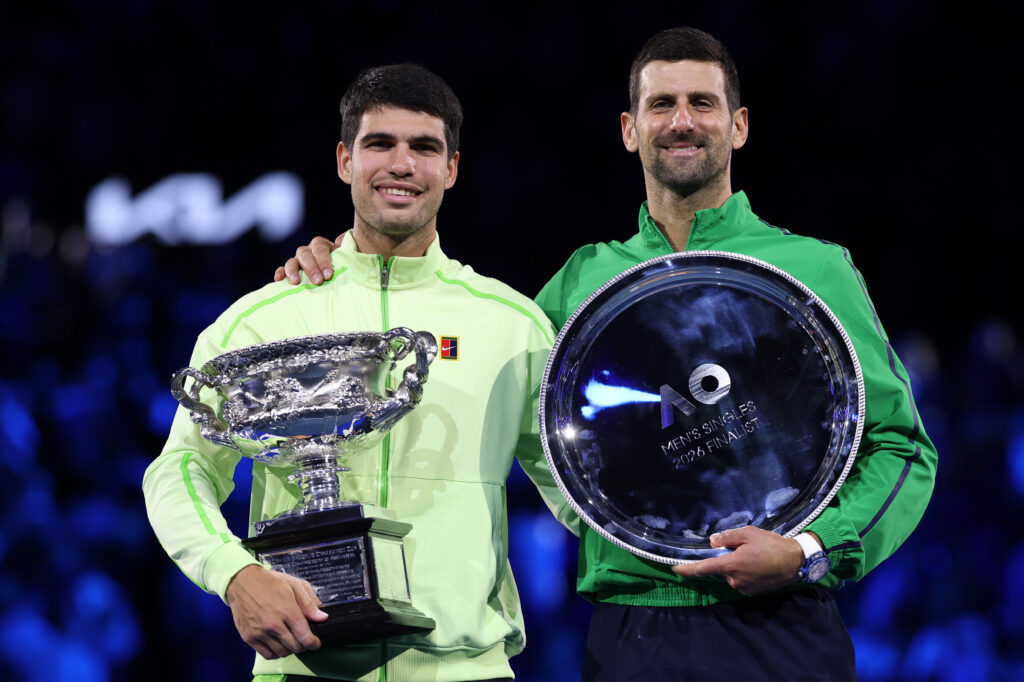 Winner Carlos Alcaraz of Spain and runner-up Novak Djokovic of Serbia pose at the presentation ceremony after the Men's Singles Final during day 15 of the 2026 Australian Open
