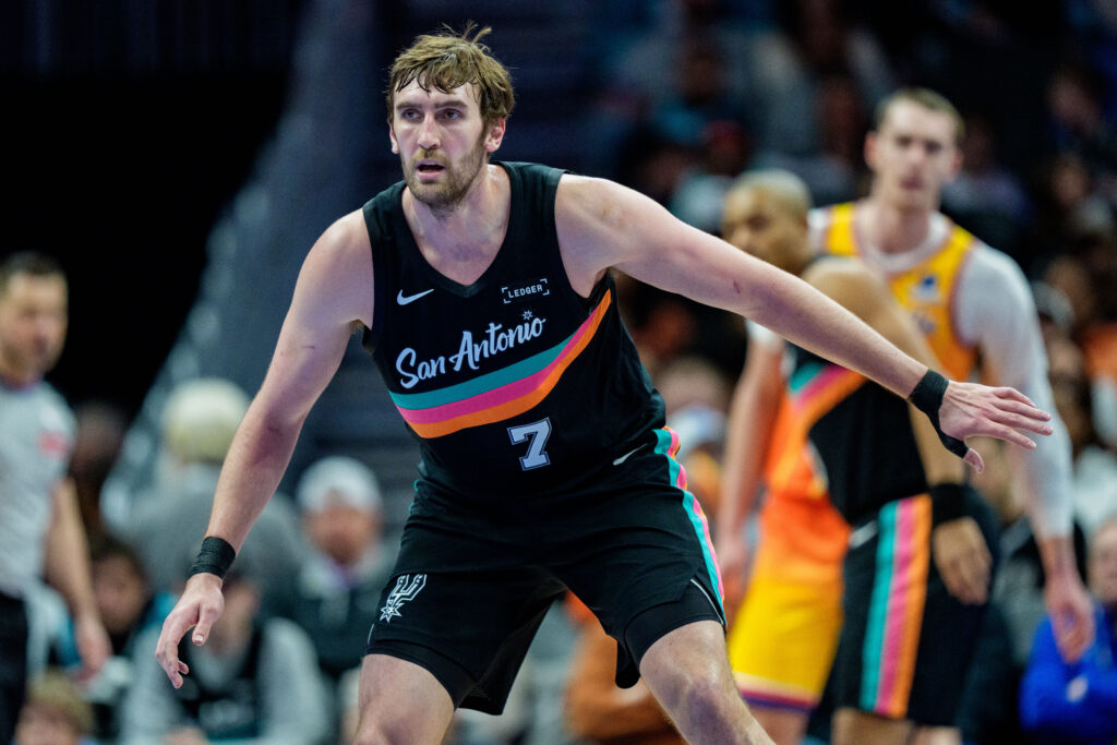Luke Kornet #7 of the San Antonio Spurs defends against the Charlotte Hornets during their game at Spectrum Center on January 31, 2026 in Charlotte, North Carolina.