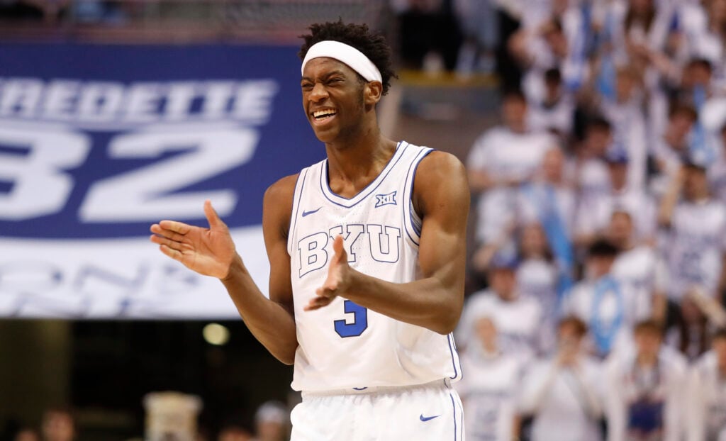 AJ Dybantsa #3 of the Brigham Young Cougars reacts after a teammate scored in the second half of a game against the Colorado Buffaloes at the Marriott Center on February 14, 2026 in Provo, Utah.