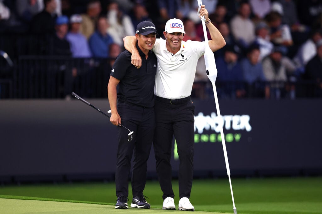 Collin Morikawa and Billy Horschel laugh during their TGL match