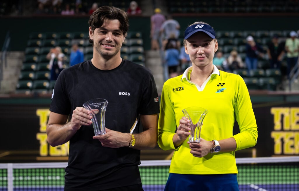 Taylor Fritz and Elena Rybakina pose with their trophies after winning the 2026 Eisenhower Cup exhibition event at Indian Wells.