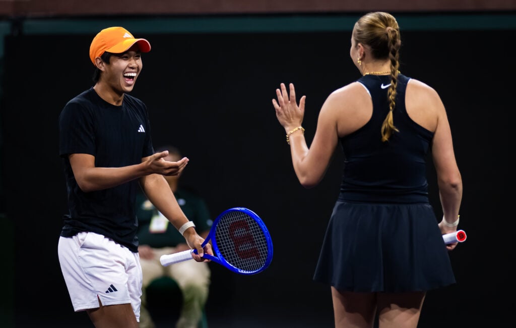 Learner Tien and Amanda Anisimova interact during mixed doubles match at Indian Wells in 2026.