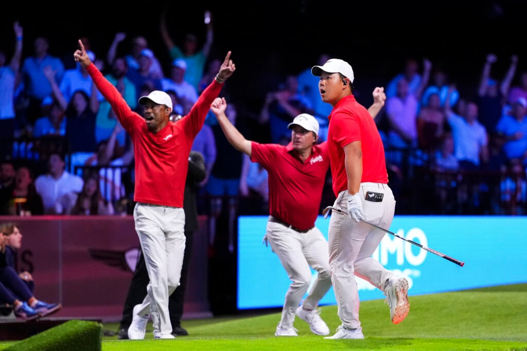 Tom Kim of Jupiter Links GC celebrates with teammates after hitting a hole-in-one on the 14th hole during a match against The Bay Golf Club