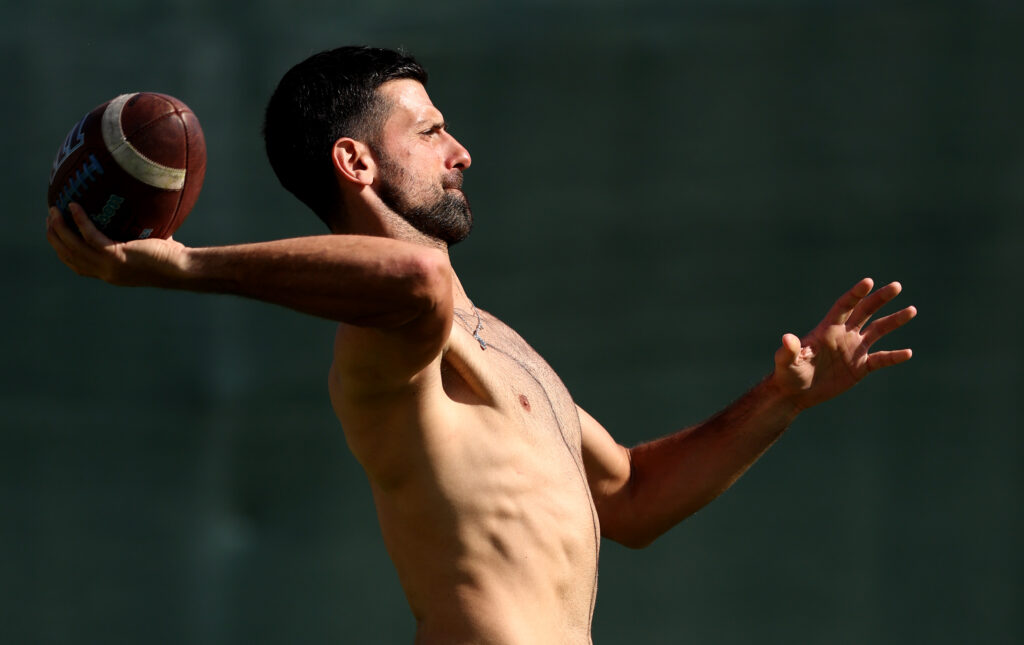 Novak Djokovic playing American football.