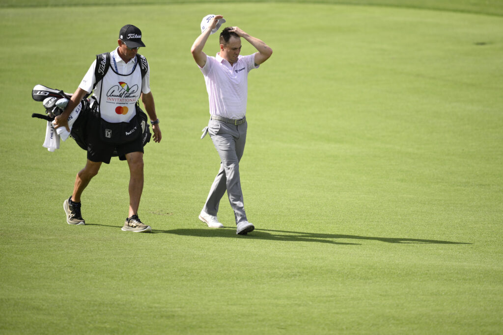 Justin Thomas of the United States reacts as he walks down the second hole during the second round of the Arnold Palmer Invitational presented by Mastercard 2026 at Arnold Palmer Bay Hill Golf Course