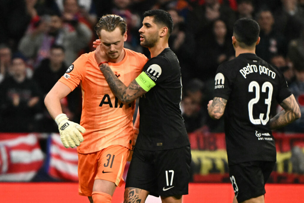 Tottenham Hotspur's Argentinian defender #17 Cristian Romero conforts Tottenham Hotspur's Czech goalkeeper #31 Antonin Kinsky after his substitution during the UEFA Champions League last 16 first leg football match between Club Atletico de Madrid and Tottenham Hotspur at Metropolitano Stadium.