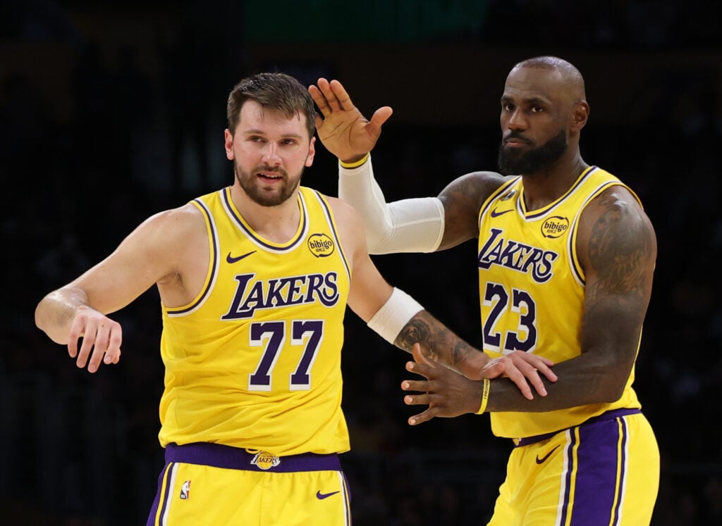 Lakers forward LeBron James, #23, right, congratulates Lakers guard Luka Doncic after he sank a three-point shot, totaling 51 points for the game against the Bulls in the second half at Crypto.com Arena.