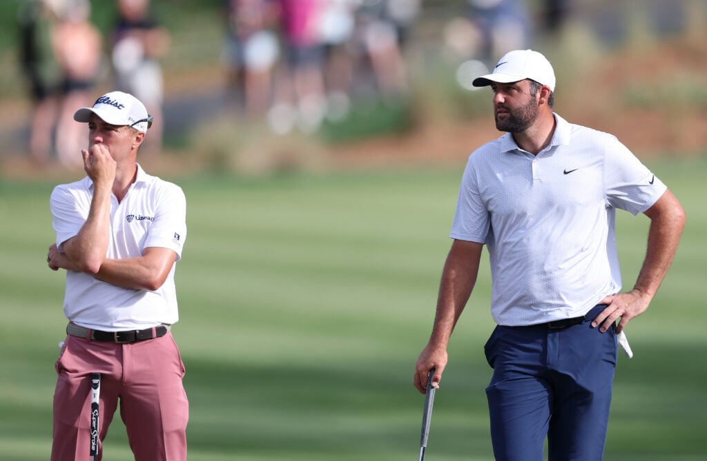 Justin Thomas and Scottie Scheffler on the 14th green during the first round of THE PLAYERS Championship at TPC Sawgrass