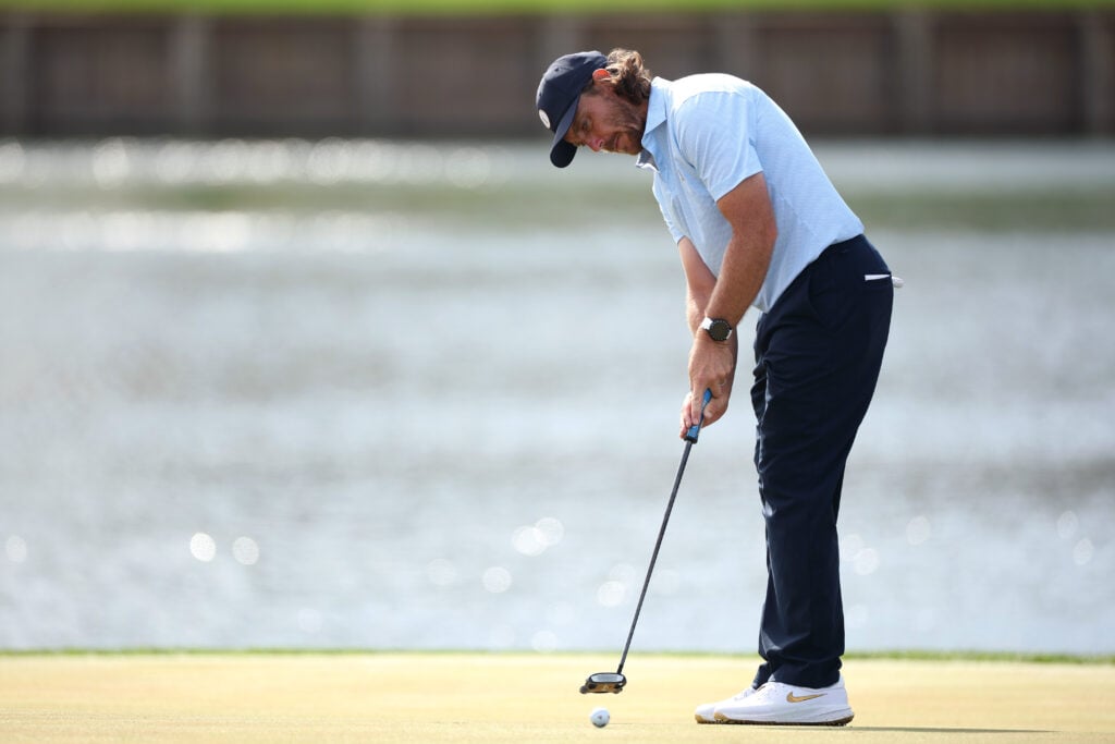 Tommy Fleetwood hits a putt on the 17th hole at The Players Championship at TPC Sawgrass
