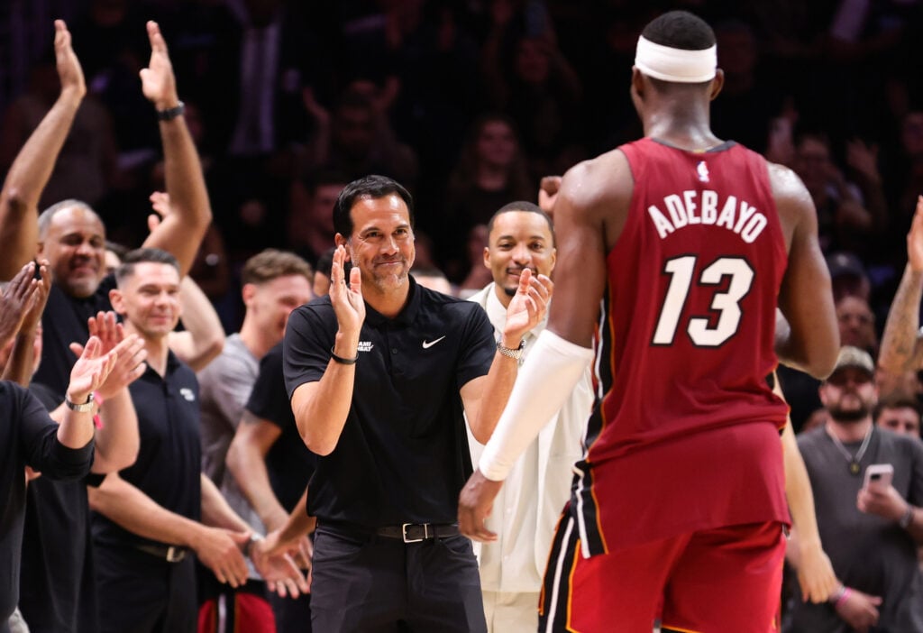 Head coach Erik Spoelstra of the Miami Heat celebrates as Bam Adebayo #13 leaves the game during the fourth quarter against the Washington Wizards. at Kaseya Center.
