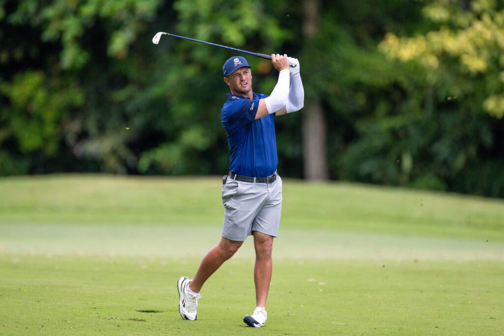 Bryson DeChambeau of Crushers GC plays his approach on hole 12 during day two of LIV Golf Singapore at Sentosa Golf Club