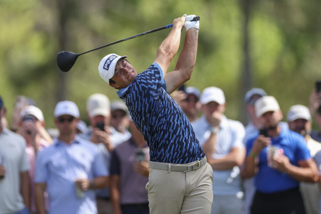 Viktor Hovland plays a tee shot on the ninth hole during THE PLAYERS Championship