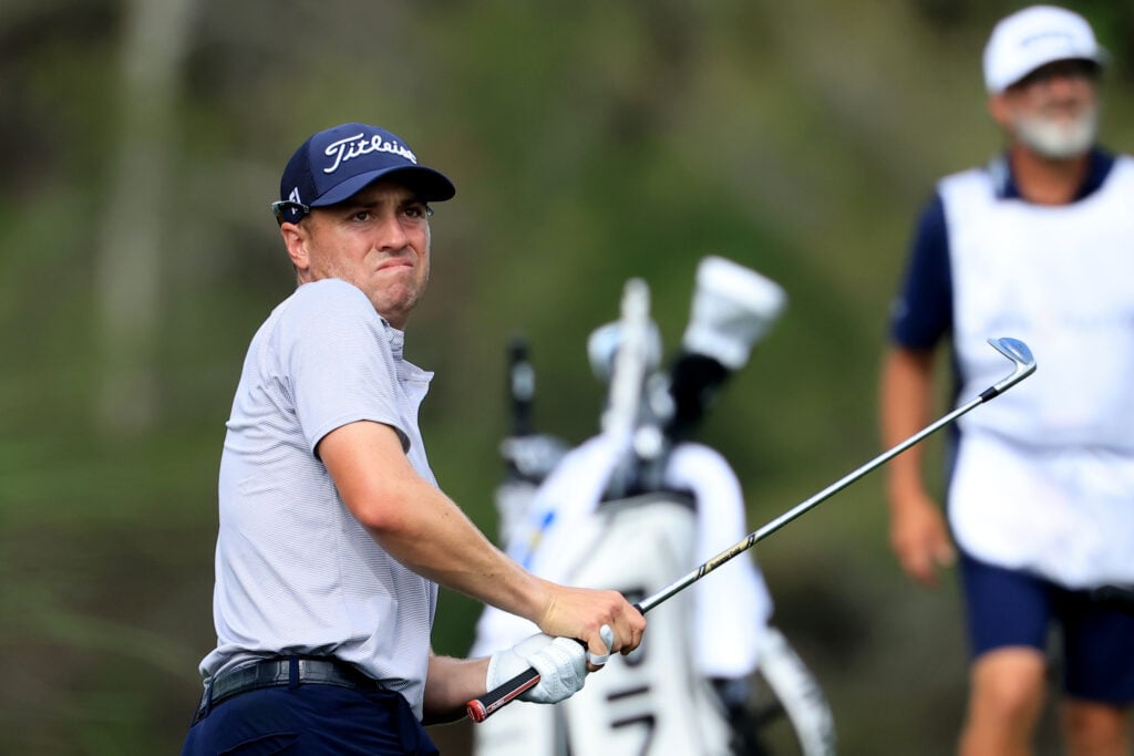 Justin Thomas hits his second shot on the 14th hole during the final round of THE PLAYERS Championship 2026 at THE PLAYERS Stadium course at TPC Sawgrass