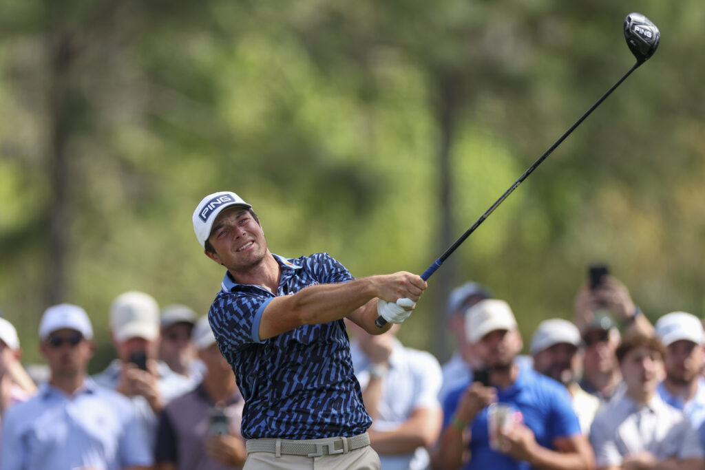 Viktor Hovland plays a tee shot on the ninth hole during THE PLAYERS Championship