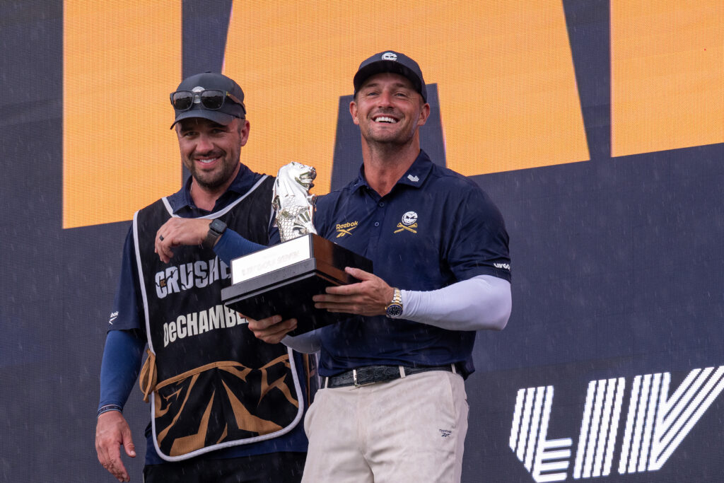 Bryson DeChambeau on the podium after winning LIV Golf Singapore