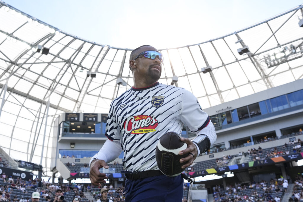 Jalen Hurts #1 of Founders FFC runs with the ball against the Wildcats FFC and scores a touchdown during the Fanatics Flag Football Classic 2026 at BMO Stadium.