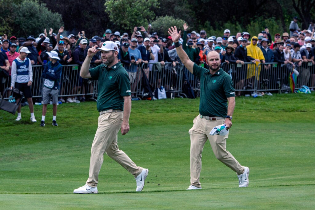 Branden Grace and Dean Burmester of Southern Guards acknowledge the crowds after LIV Golf South Africa