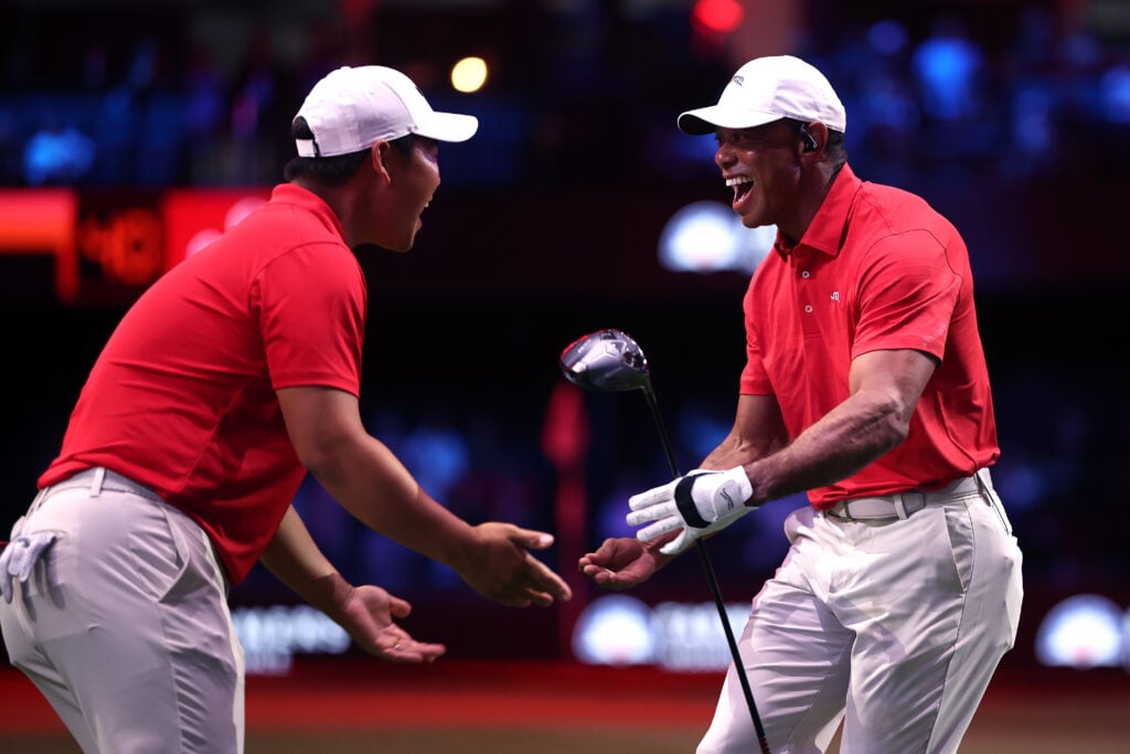 Tiger Woods and Tom Kim of Jupiter Links Golf Club celebrate during the match against the Los Angeles Golf Club at SoFi Center