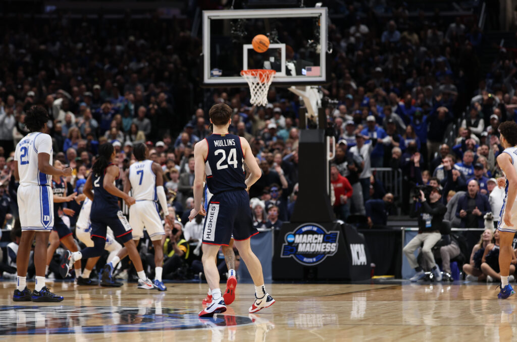 Braylon Mullins #24 of the UConn Huskies hits the game winning shot in the second half against the Duke Blue Devils during the Elite Eight round game of the 2026 NCAA Men's Basketball Tournament held at Capital One Arena.