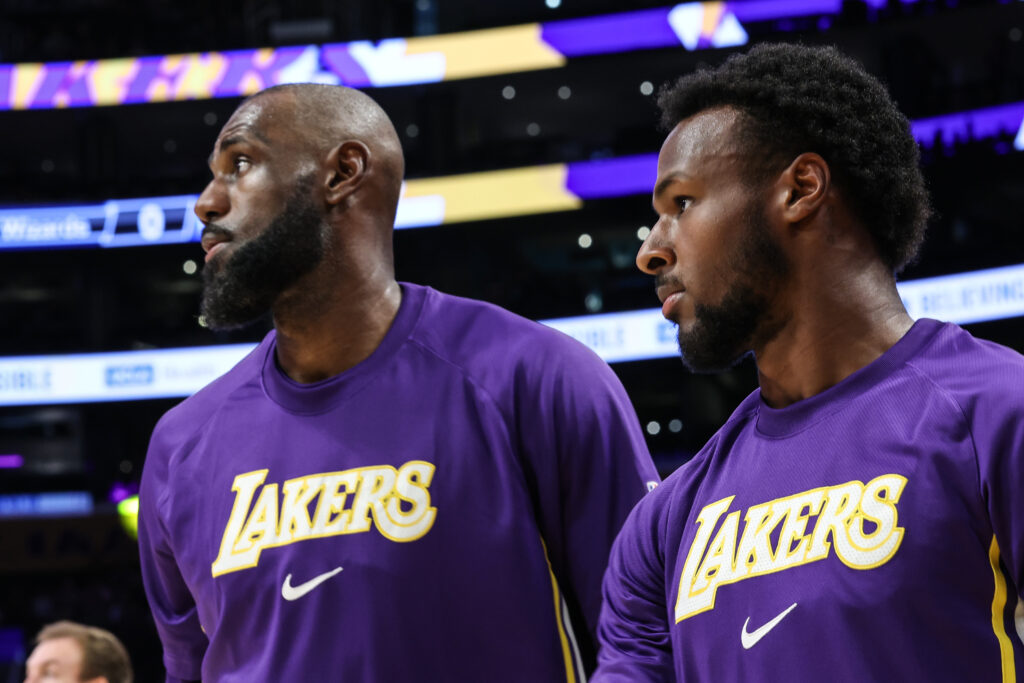 Los Angeles Lakers forward LeBron James (23) and son Bronny James (9) on the court during warmups before a game against the Washington Wizards at Crypto.Com Arena.