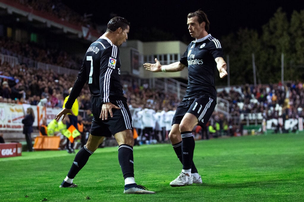 Cristiano Ronaldo (L) of Real Madrid CF celebrates scoring their opening goal with teammate Gareth Bale (R) during the La Liga match between Rayo Vallecano de Madrid and Real Madrid CF at Vallecas Stadium.