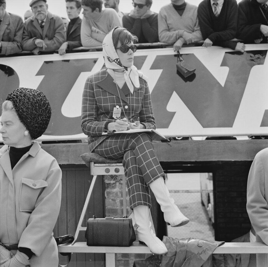 Lady Helen Stewart watches the 1967 British Grand Prix with he stop watch and timing sheet