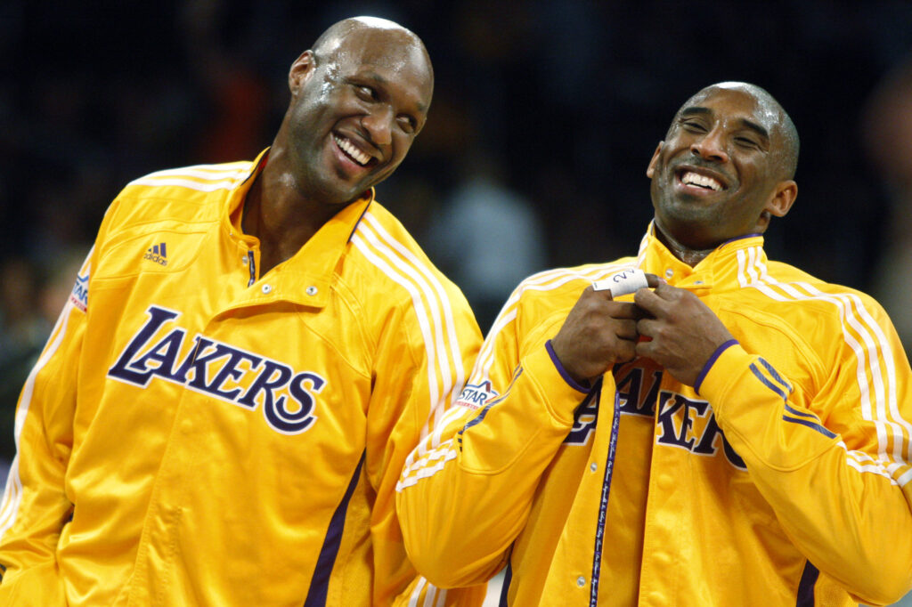 Lakers teammates Lamar Odom and Kobe Bryant share a light moment before the start of a game against the Minnesota Timberwolves.