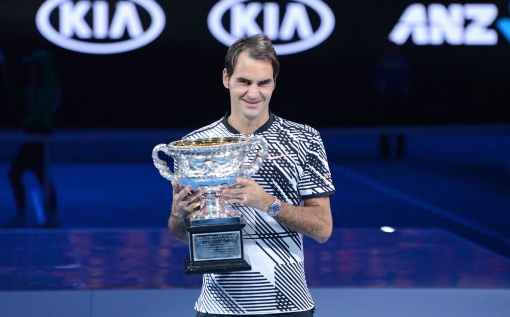 Roger Federer of Switzerland poses with the championship trophy after Australian Open 2017 men's final match against Rafael Nadal of Spain at Rod Laver Arena, in Melbourne, Australia 29 January 2017.