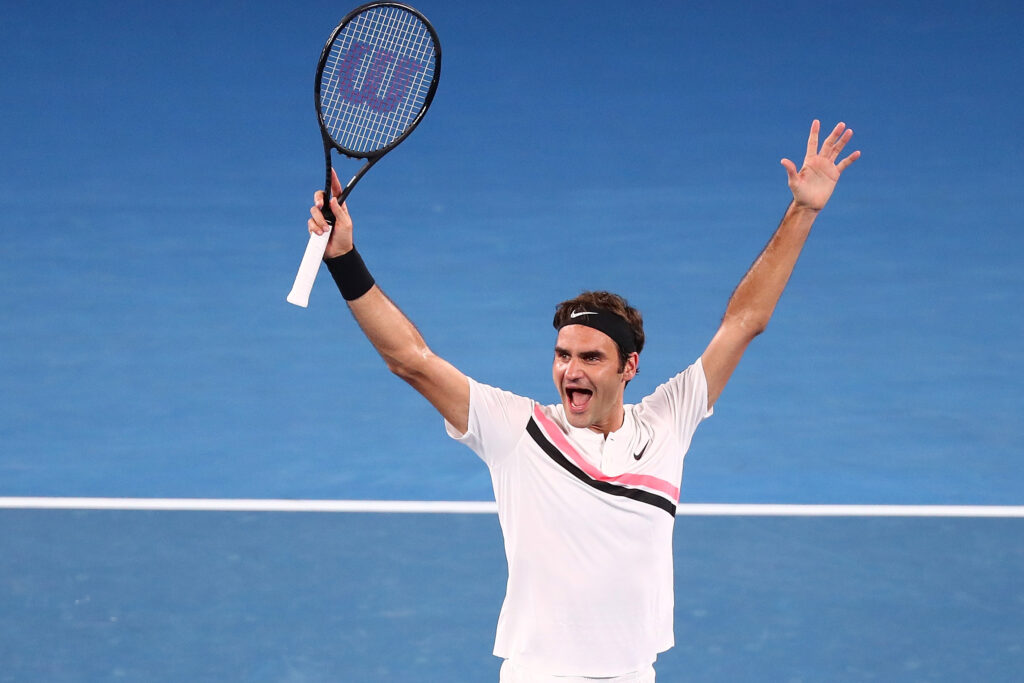 Roger Federer of Switzerland celebrates winning championship point in his men's singles final match against Marin Cilic of Croatia on day 14 of the 2018 Australian Open at Melbourne Park on January 28, 2018 in Melbourne, Australia.
