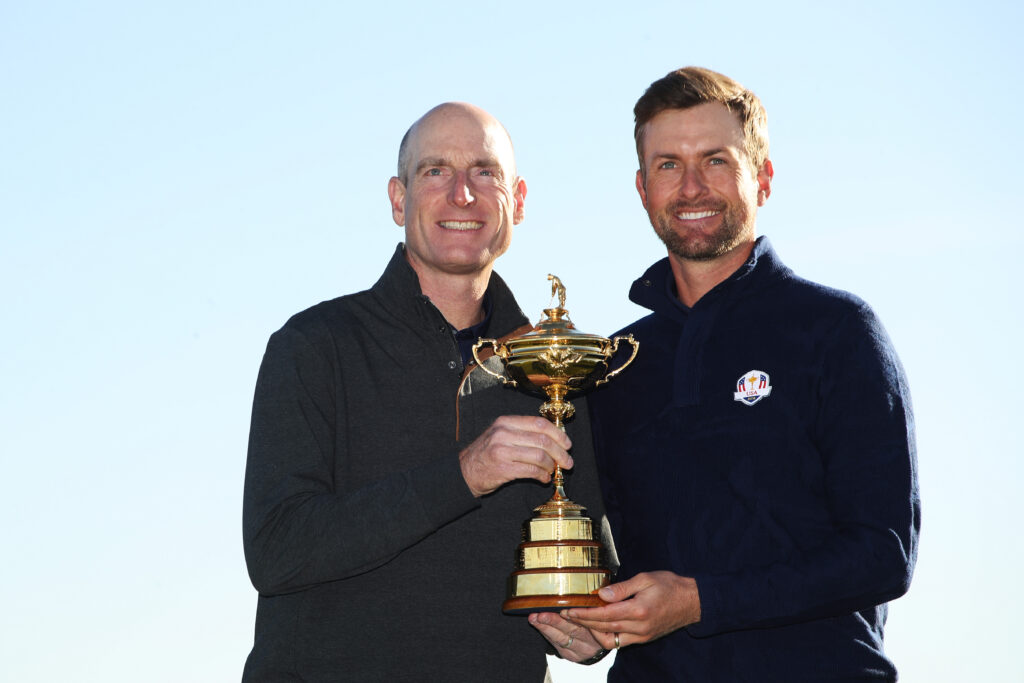 Jim Furyk and Webb Simpson hold the Ryder Cup trophy ahead of the 2018 event