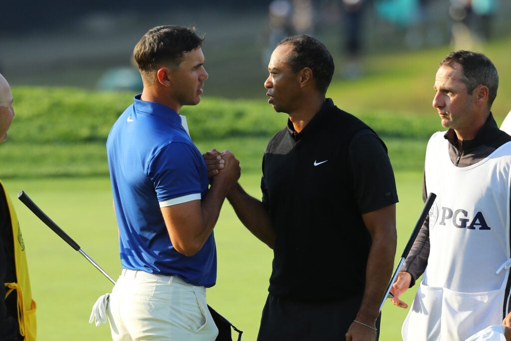 Brooks Koepka and Tiger Woods shake hands after the second round of the 2019 PGA Championship at the Bethpage Black