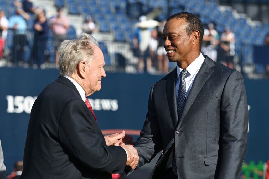 Jack Nicklaus and Tiger Woods shake hands before the Past Champions Dinner prior to The 150th Open at St Andrews