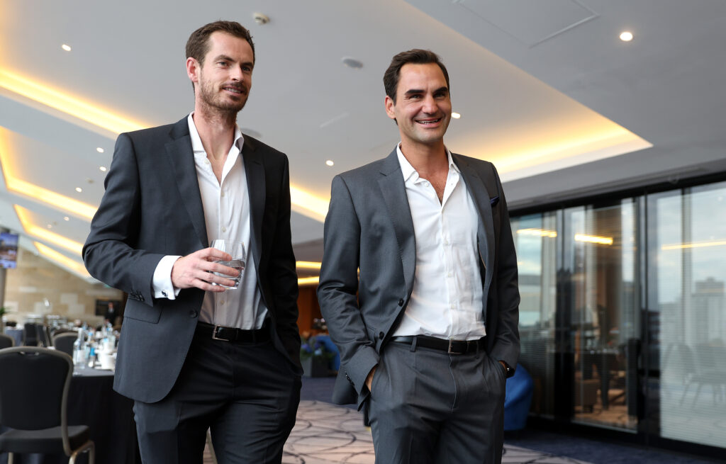 Roger Federer and Andy Murray of Team Europe talk as they prepare for a photoshoot.