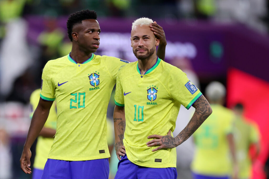 Vinicius Junior and Neymar of Brazil look dejected after their sides' elimination from the tournament after a penalty shoot out loss during the FIFA World Cup Qatar 2022 quarter final match between Croatia and Brazil at Education City Stadium on December 09, 2022 in Al Rayyan, Qatar.
