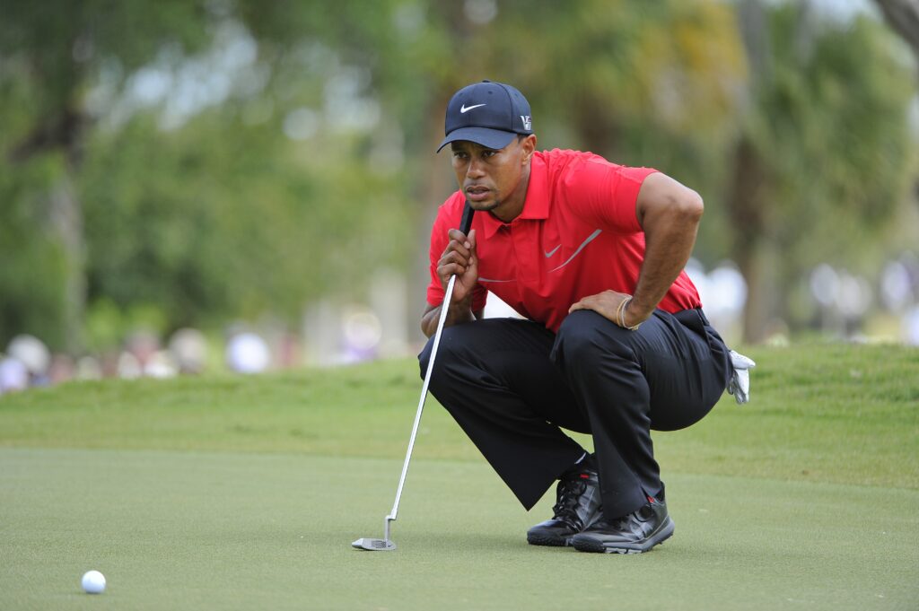 Tiger Woods lines up a putt during the final round of the WGC-Cadillac Championship