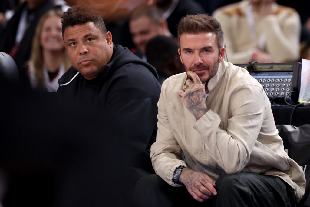 Former football players Ronaldo from Brazil and David Beckham from England attend the NBA regular season basketball match between the Cleveland Cavaliers and the Brooklyn Nets at the Accor Arena.