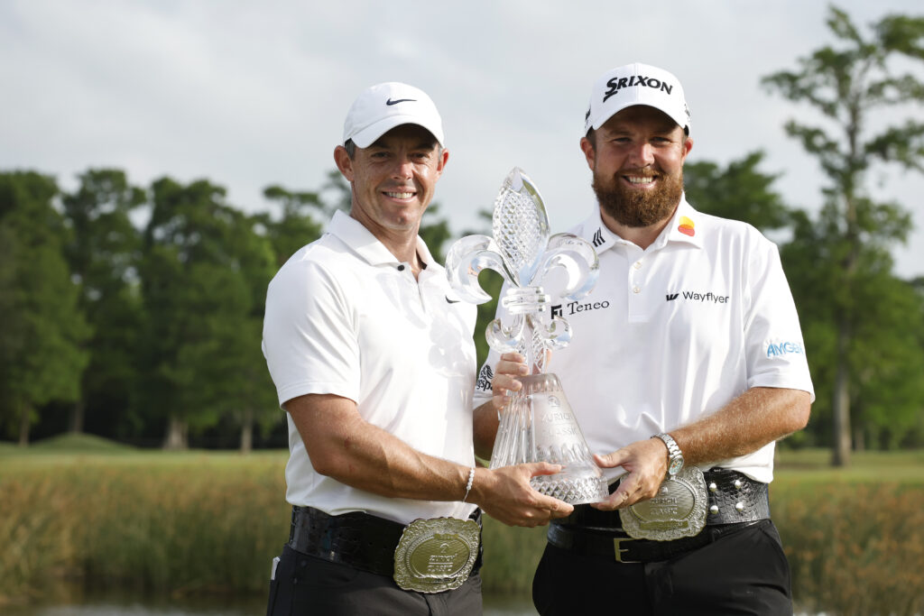 Rory McIlroy of Northern Ireland and Shane Lowry of Ireland pose with the trophy after the final round of the Zurich Classic of New Orleans