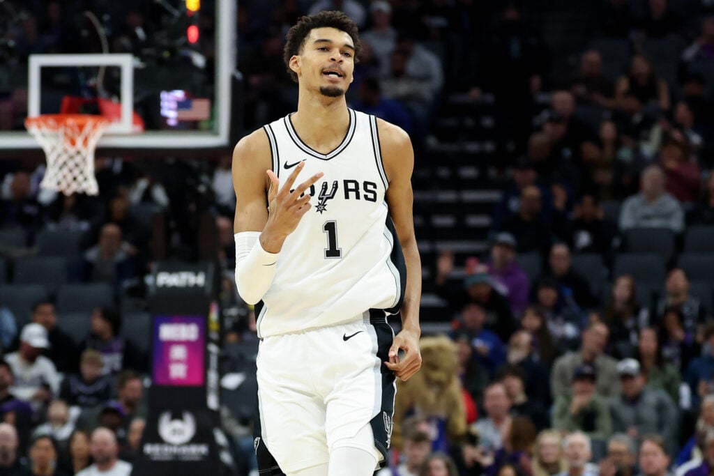 Victor Wembanyama #1 of the San Antonio Spurs reacts after making a basket against the Sacramento Kings.