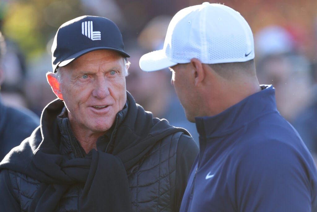 CEO Greg Norman (L) and Brooks Koepka of LIV Golf talk during The Showdown: McIlroy and Scheffler v DeChambeau and Koepka at Shadow Creek Golf Course