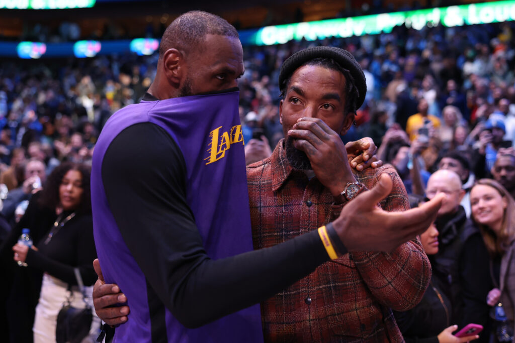 LeBron James #23 of the Los Angeles Lakers and J.R. Smith talk after the game against the Dallas Mavericks at American Airlines Center.
