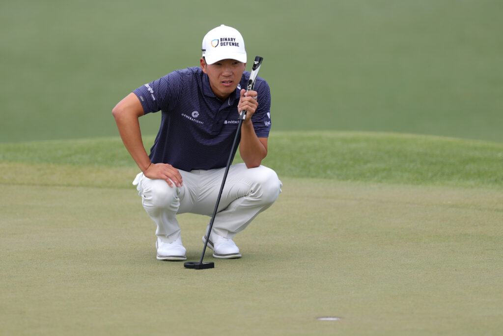 Michael Kim of the United States lines up a putt on the second green during the third round of the 2025 Masters Tournament at Augusta National Golf Club
