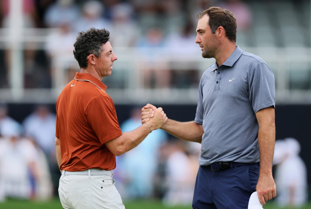 Rory McIlroy shakes hands with Scottie Scheffler on the 18th green on day two of the PGA Championship at Quail Hollow in 2025