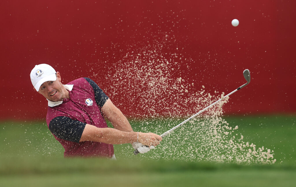 Rory McIlroy plays from a bunker during practice prior to the Ryder Cup at Bethpage Black