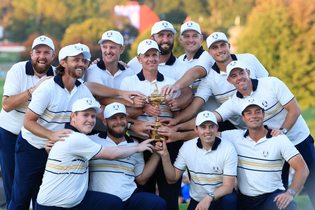 Luke Donald, Shane Lowry, Rasmus Hojgaard, Justin Rose, Jon Rahm, Sepp Straka, Ludvig Aberg, Rory McIlroy, Viktor Hovland, Matt Fitzpatrick, Tommy Fleetwood, Robert MacIntyre and Tyrrell Hatton of Team Europe hold the Ryder Cup trophy