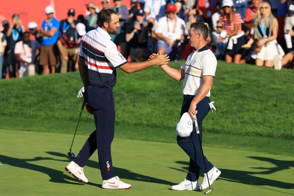 Rory McIlroy and Scottie Scheffler shake hands after their singles match at the Ryder Cup